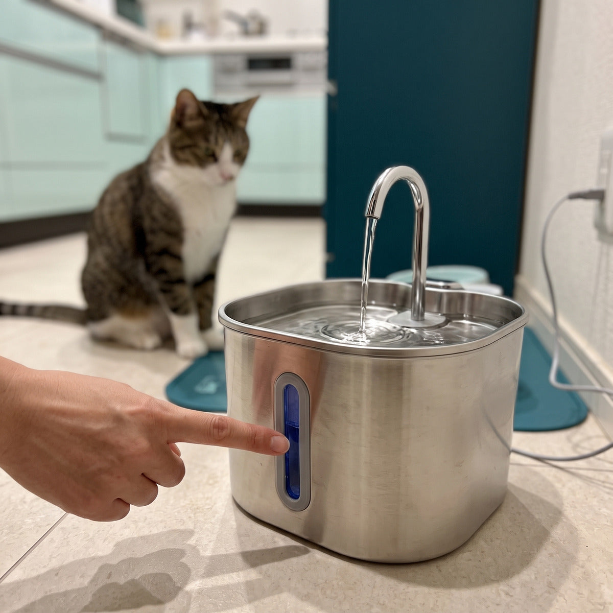 Hand checking the water-level window